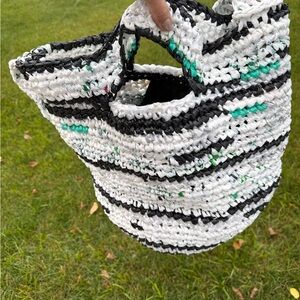 Handmade from plastic bags crocheted shopping tote bag with a pocket